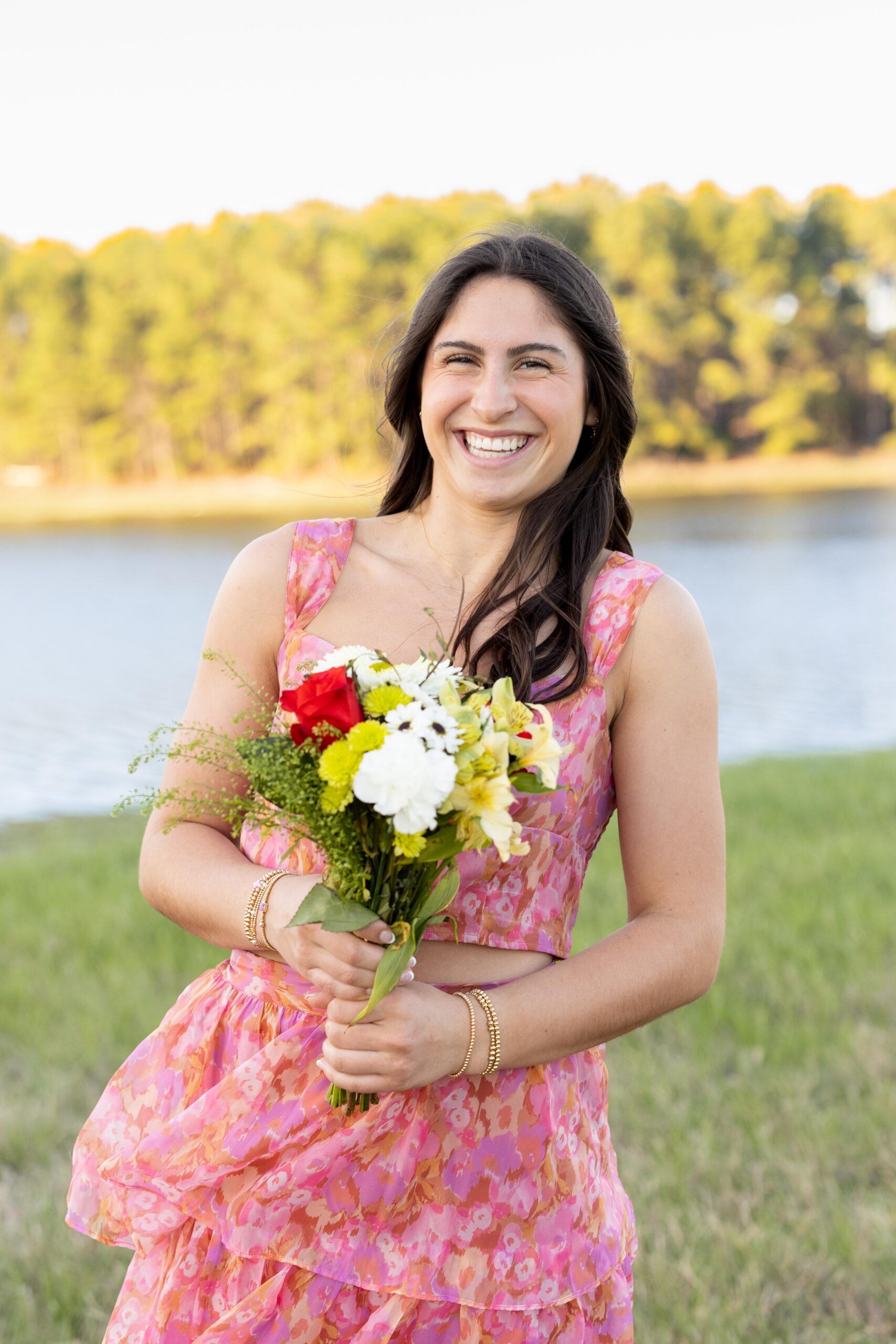 High School Senior with Flower Bouquet at a Lake